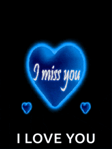 a blue heart with i miss you written on it