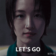 a close up of a woman 's face with the words let 's go written on it