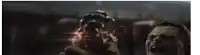 a man is holding a bloody hand in front of a man .