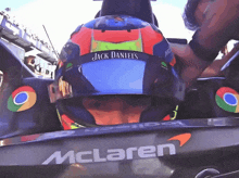 a man wearing a helmet that says jack daniels on it