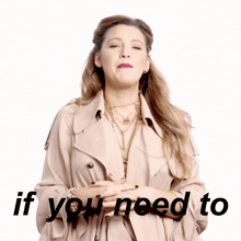 a woman wearing a trench coat and necklaces says if you need to