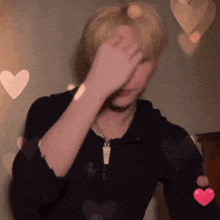 a blurry photo of a person with hearts surrounding them