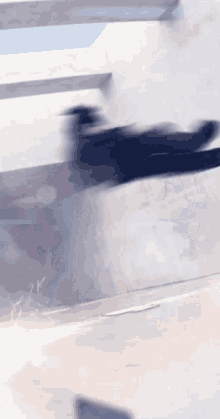 a blurry picture of a person jumping in the air with the letter y visible