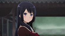 a girl with long black hair and purple eyes is looking at the camera