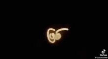 a tiktok video of a drawing of a worm on a black background