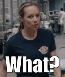 a woman in a blue shirt says what