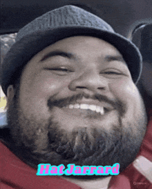 a man with a beard wearing a hat and smiling with the name hat jarrard above him