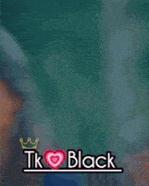 a blurred image of a man and a woman with the words tk black on the bottom