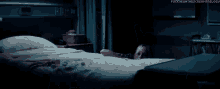 a woman is laying in a hospital bed with the words fuckyeahthescreamtrilogy written above her