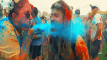 blow colored powder gifkaro colored powder on your face festival holi