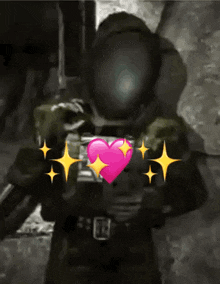 a man in a helmet is holding a gun with a pink heart in his chest .