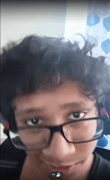 a close up of a person wearing glasses