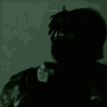 a blurry picture of a person 's face with the words `` lxrdgxd '' on the bottom .