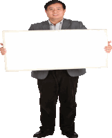 a man in a suit is holding a white board in his hands