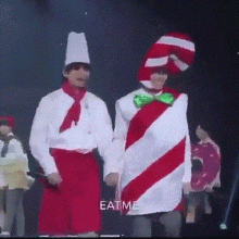 two men dressed up as cat in the hat and a chef holding hands