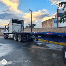 a motorola edge 50 pro photo of a flatbed semi truck