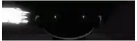 a close up of a person 's face in the dark .