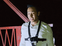 a man wearing a harness with a camera on it