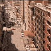 an aerial view of a city street with a lot of buildings