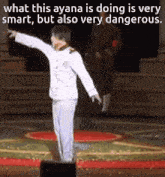 a man in a white uniform is standing on a stage and pointing at something
