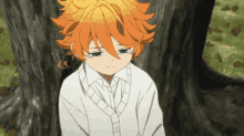 a young girl with orange hair is sitting under a tree with her eyes closed
