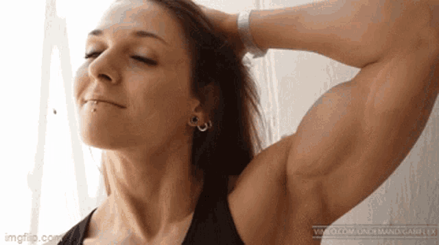 female bodybuilder flexing biceps - Playground