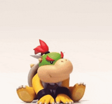 a blurred image of a toy that looks like a turtle with a red tail .
