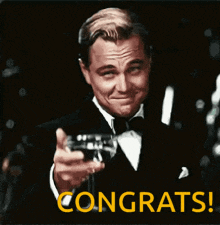 a man in a tuxedo is toasting with a glass of wine and the word congrats is on the bottom right