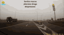 a picture of a highway with a mcdonalds sign in the background