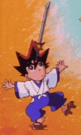 a boy in a kimono is holding a sword over his head .