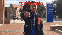 a man is pointing at the camera with the words you 've been written above him