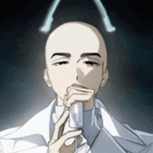 a bald man in a white coat is holding a glass in his hand .