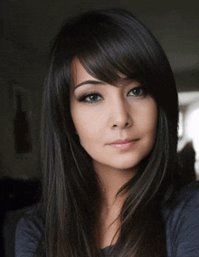 a close up of a woman 's face with long hair
