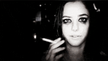 a close up of a woman 's face with a blurry background