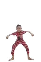 a young boy in a red shirt and pants with the word supreme on them