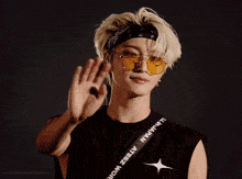a young man wearing sunglasses and a bandana with the word japan on the strap