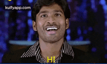 a man is making a funny face and saying hi .