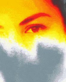 a close up of a woman 's eye with a rainbow of colors