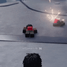 a person is playing a video game and a person is standing in front of a person in a video game .