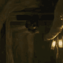 a close up of a chandelier in a dark room