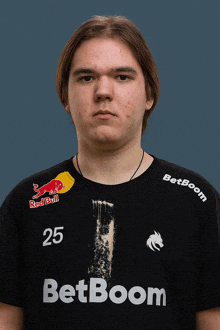 a man wearing a black shirt with the number 25 on it