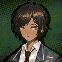 a girl with short hair is wearing a suit and tie and has the number 12 on her chest