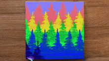 a painting of a forest with trees painted in rainbow colors