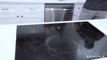 a black stove top with the words made in animotica on the bottom