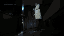 a man in a lab coat stands in front of a periodicvideos.com logo