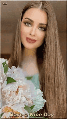 a woman with long hair is holding flowers and the words have a nice day are below her