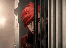 a woman with red hair is behind bars and looking out