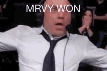 a man wearing headphones and a tie with the words mrvy won on his face