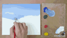 a person is painting on a canvas with the words made in animatica visible