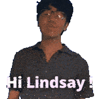 a man wearing glasses and a shirt that says hi lindsay waves his hand